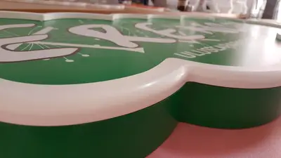 Erengül Çiçekçilik — mall kiosk — white laminate panels, backlit sign (production)