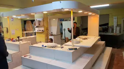 Erengül Çiçekçilik — mall kiosk — crown signage above the unit, green (production)