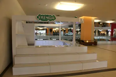 Erengül Çiçekçilik — mall kiosk — white laminate panels, backlit sign (the unit installed in place)