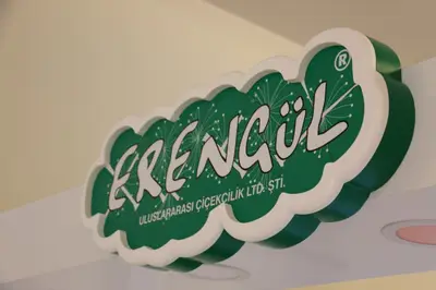 Erengül Çiçekçilik — mall kiosk — crown signage above the unit, green (the unit installed in place)