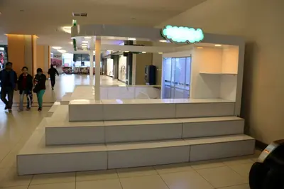 Erengül Çiçekçilik — mall kiosk — white laminate panels, backlit sign (both in the workshop and on site)