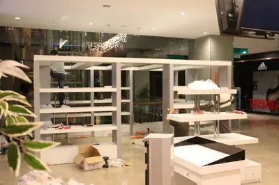 May Gift Shop — mall kiosk — full-length glass display cases, under-shelf LED strip (on-site assembly)
