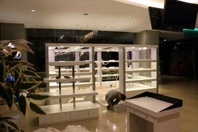 May Gift Shop — mall kiosk — tempered glass display cases, under-shelf LED strip (on-site assembly)
