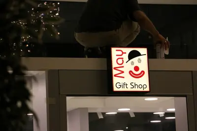 May Gift Shop — mall kiosk — cross-plan island footprint, white (on-site assembly)