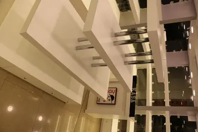 May Gift Shop — mall kiosk — full-length glass display cases, white (on-site assembly)