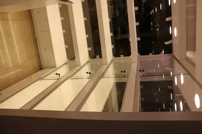 May Gift Shop — mall kiosk — crown signage above the unit, white (on-site assembly)
