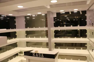 May Gift Shop — mall kiosk — white laminate panels, white (on-site assembly)