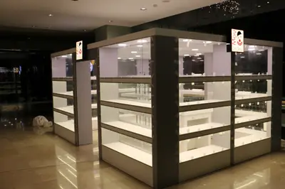 May Gift Shop — mall kiosk — cross-plan island footprint, red (on-site assembly)