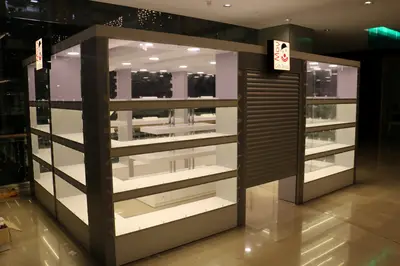May Gift Shop — mall kiosk — white laminate panels, red (on-site assembly)