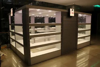 May Gift Shop — mall kiosk — tempered glass display cases, red (on-site assembly)