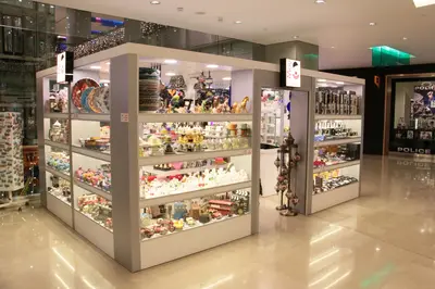 May Gift Shop — mall kiosk — crown signage above the unit, backlit sign (the unit installed in place)