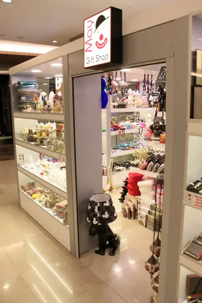 May Gift Shop — mall kiosk — white laminate panels, backlit sign (the unit installed in place)