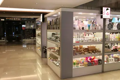 May Gift Shop — mall kiosk — cross-plan island footprint, anthracite (the unit installed in place)