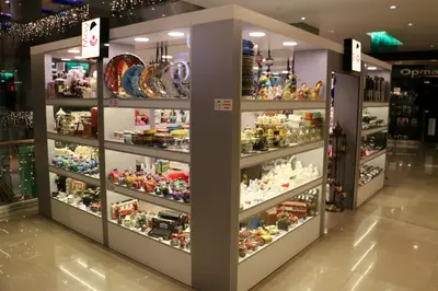 May Gift Shop — mall kiosk — crown signage above the unit, anthracite (the unit installed in place)