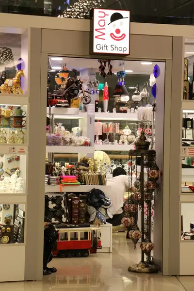 May Gift Shop — mall kiosk — white laminate panels, white (the unit installed in place)