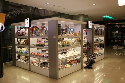May Gift Shop — mall kiosk — cross-plan island footprint, red (the unit installed in place)