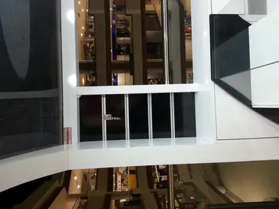 Özsoy Eşarp — Olivium — mall kiosk — tinted and mirrored glass panels, recessed downlights