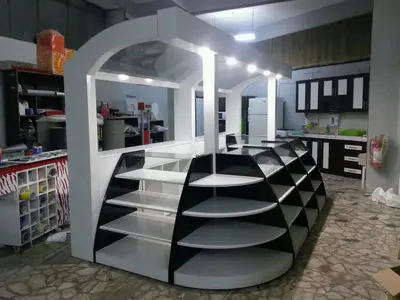 Özsoy Eşarp — Olivium — mall kiosk — tempered glass display cases, recessed downlights