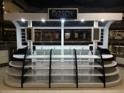 Özsoy Eşarp — Olivium — mall kiosk — tinted and mirrored glass panels, white