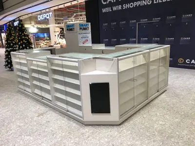 Smartpunkt — mall kiosk — full-length glass display cases, under-shelf LED strip