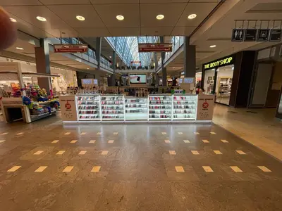 Smartpunkt — mall kiosk — multi-faceted polygonal footprint, white