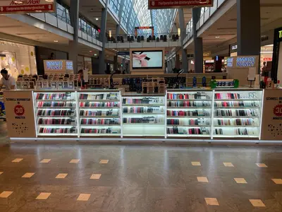 Smartpunkt — mall kiosk — tiered open shelving, white