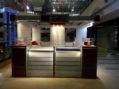 2E İletişim — Tekira AVM — mall kiosk — raised towers at both ends, backlit sign