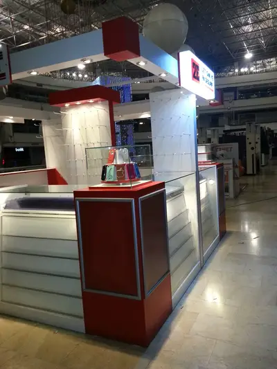 2E İletişim — Tekira AVM — mall kiosk — full-length glass display cases, backlit sign