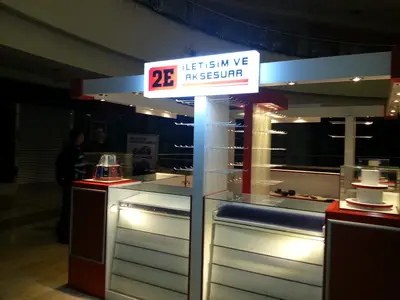 2E İletişim — Tekira AVM — mall kiosk — under-counter storage, backlit sign