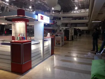2E İletişim — Tekira AVM — mall kiosk — crown signage above the unit, backlit sign