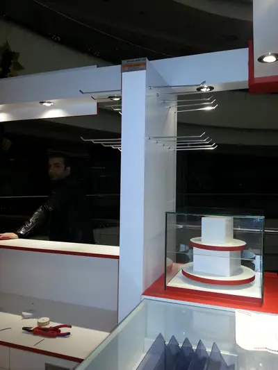 2E İletişim — Tekira AVM — mall kiosk — raised towers at both ends, white