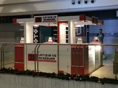 2E İletişim — Tekira AVM — mall kiosk — red gloss panels, white