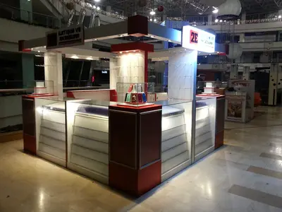 2E İletişim — Tekira AVM — mall kiosk — full-length glass display cases, maroon
