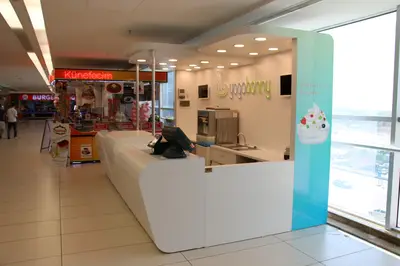 Yogobonny — mall kiosk — full-length glass display cases, recessed downlights