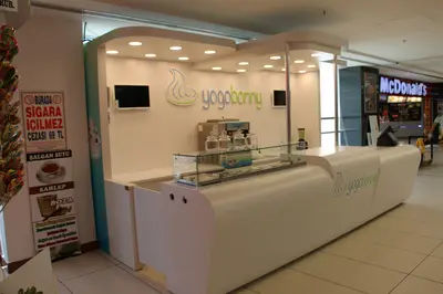 Yogobonny — mall kiosk — fully rounded organic form, backlit sign